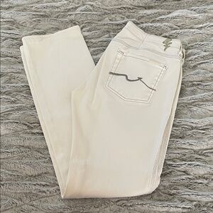 7 For All Mankind White Straight-Leg Jeans with Contrast Stitching.